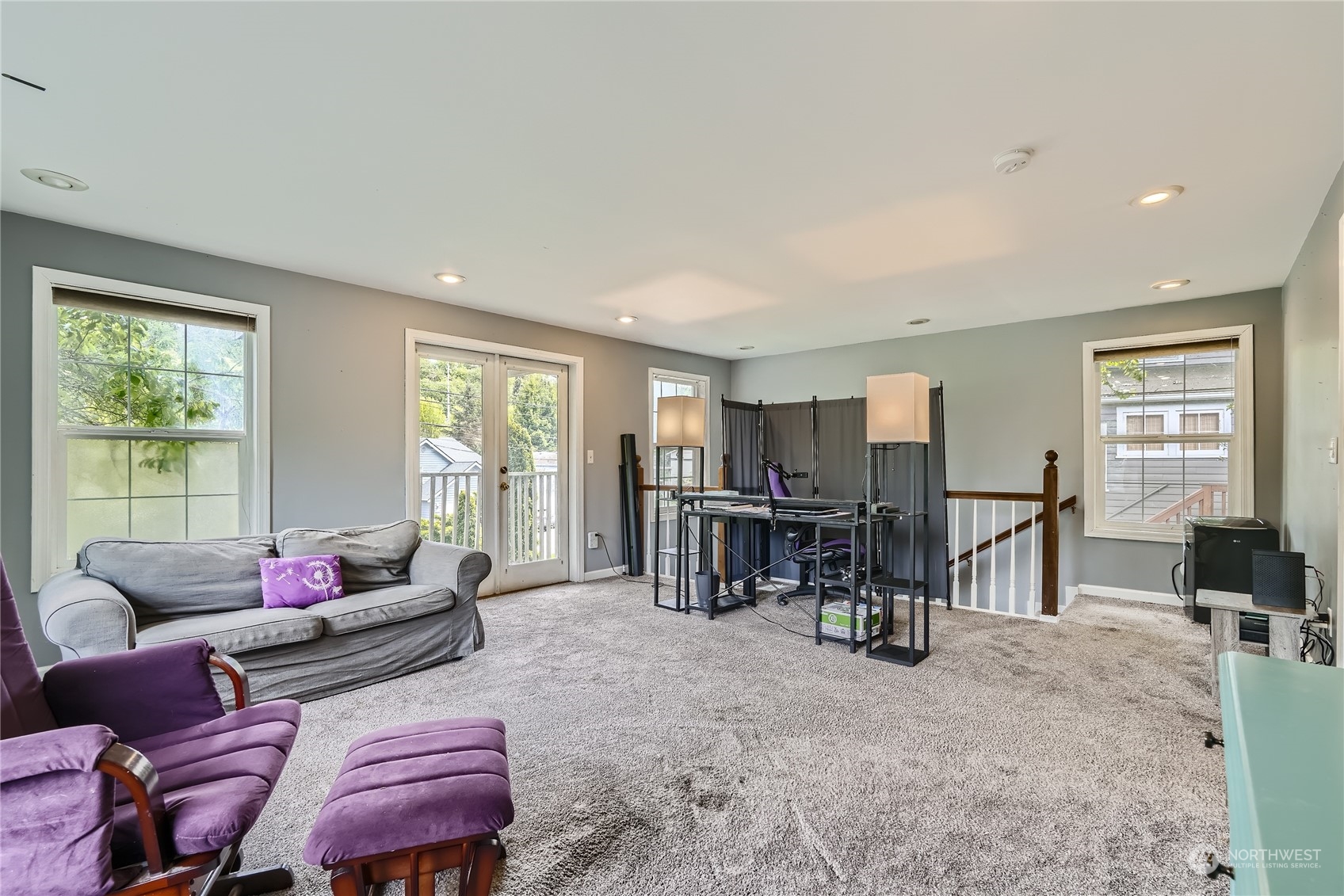 6935 24th Avenue Southwest Seattle, WA 98106 - Photo 12 of 27 a living room with furniture and a window