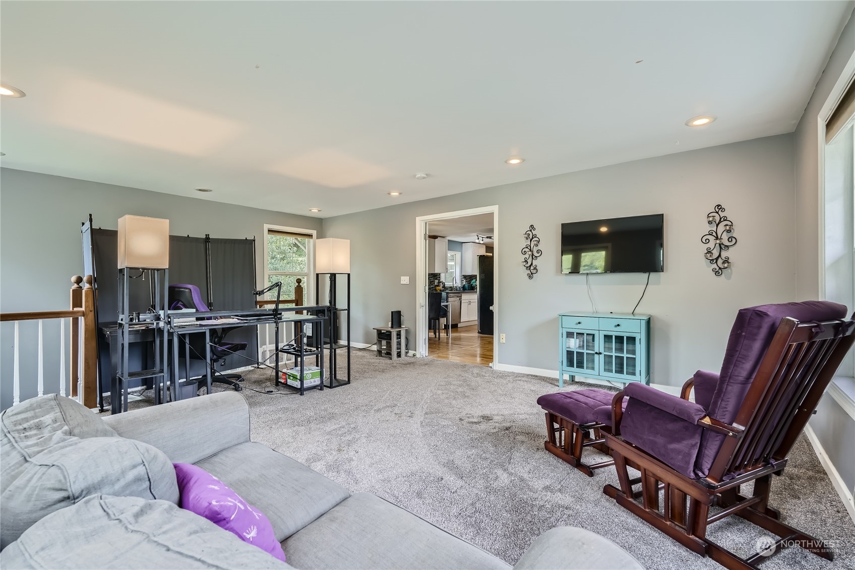 6935 24th Avenue Southwest Seattle, WA 98106 - Photo 13 of 27 a living room with furniture and a flat screen tv
