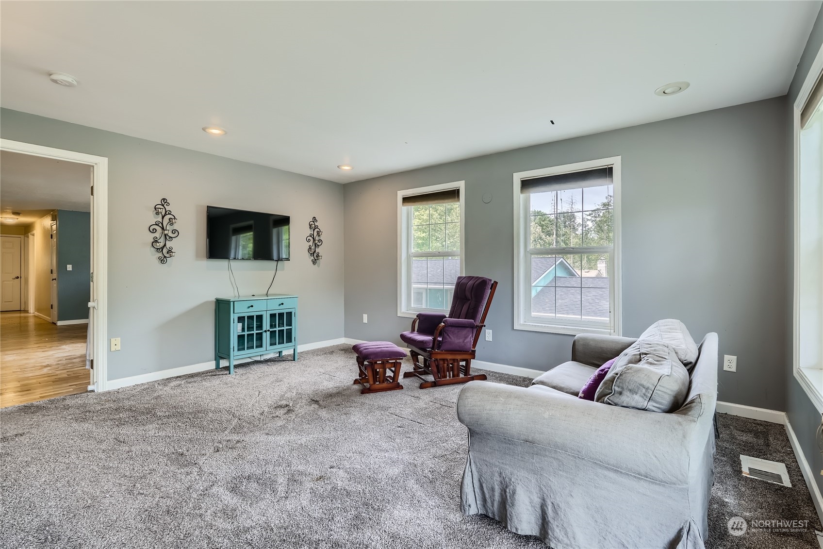 6935 24th Avenue Southwest Seattle, WA 98106 - Photo 14 of 27 a living room with furniture and a flat screen tv