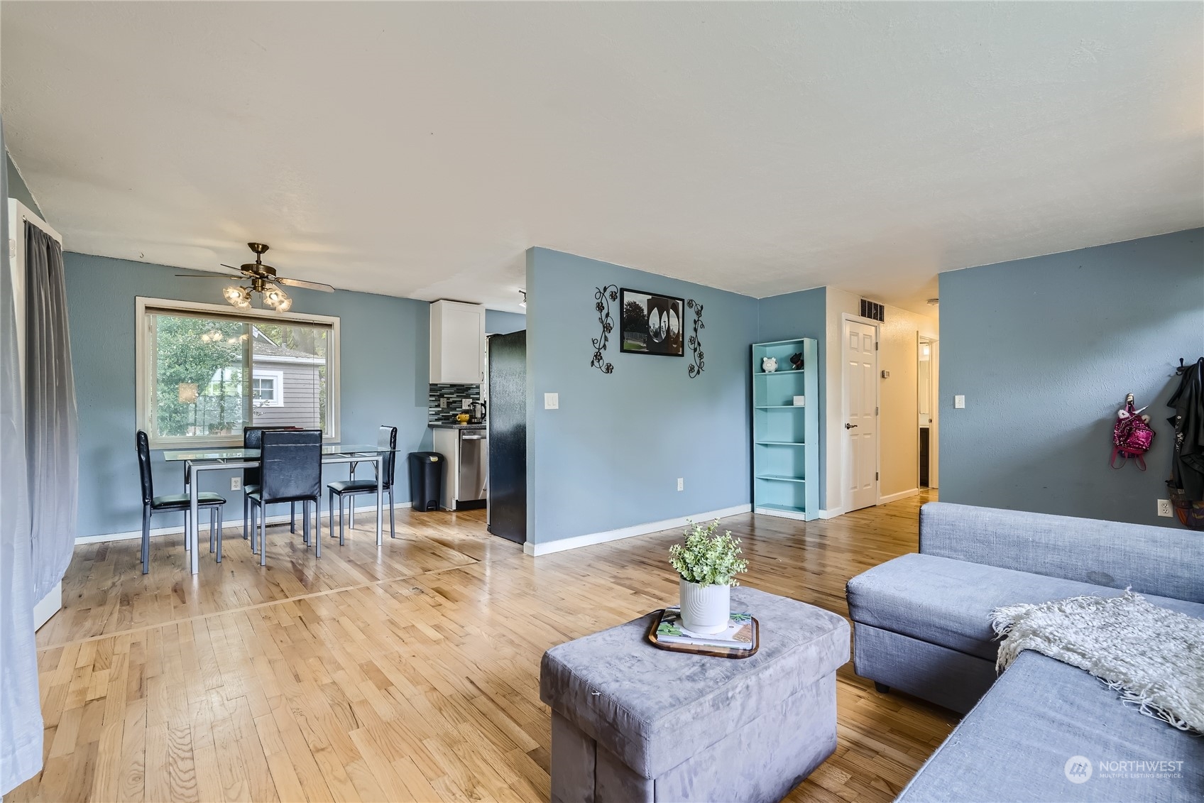 6935 24th Avenue Southwest Seattle, WA 98106 - Photo 3 of 27 a living room with furniture and wooden floor