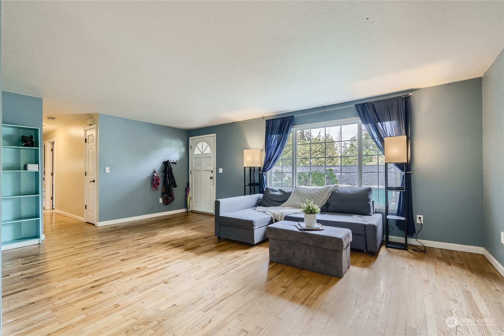6935 24th Avenue Southwest Seattle, WA 98106 - Photo 4 of 27 a living room with furniture and a large window