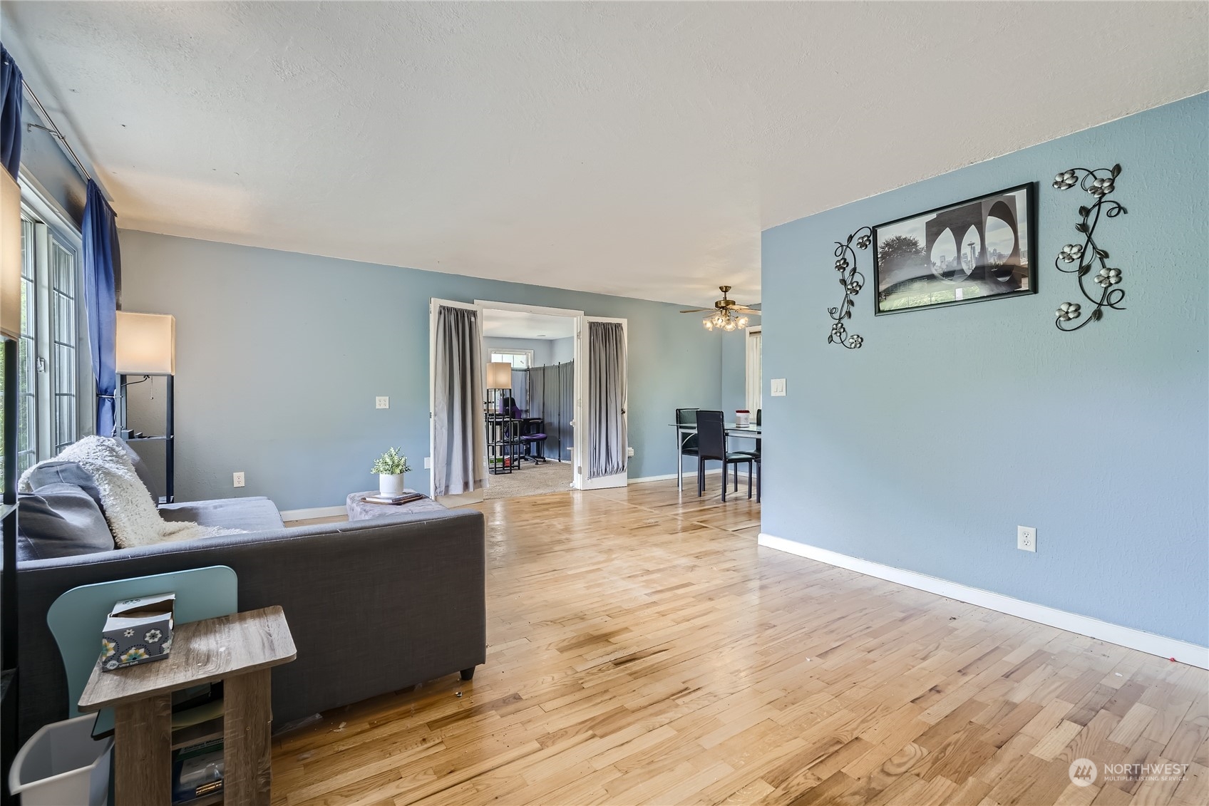 6935 24th Avenue Southwest Seattle, WA 98106 - Photo 5 of 27 a living room with furniture and a wooden floor