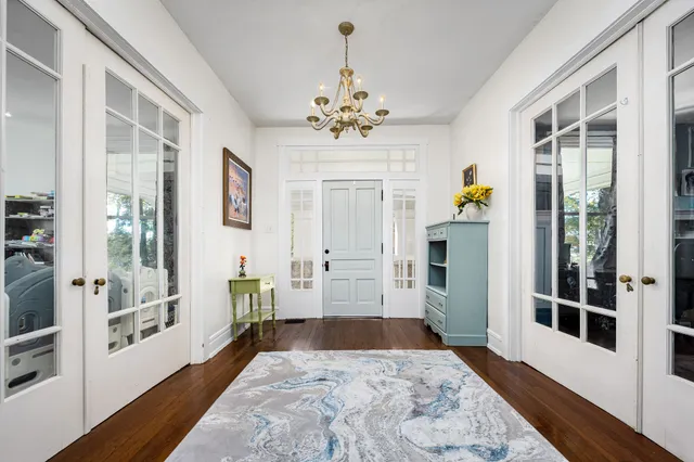 a spacious bedroom with a large bed and a large window