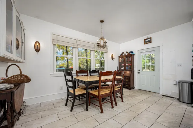 a bedroom with a bed dresser and a window