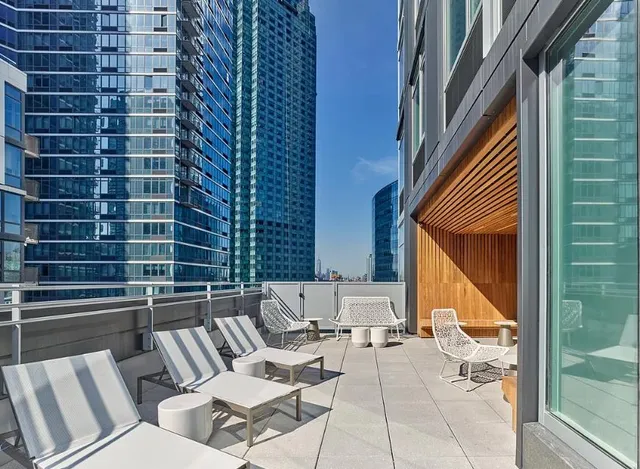 a living room with furniture and flat screen tv