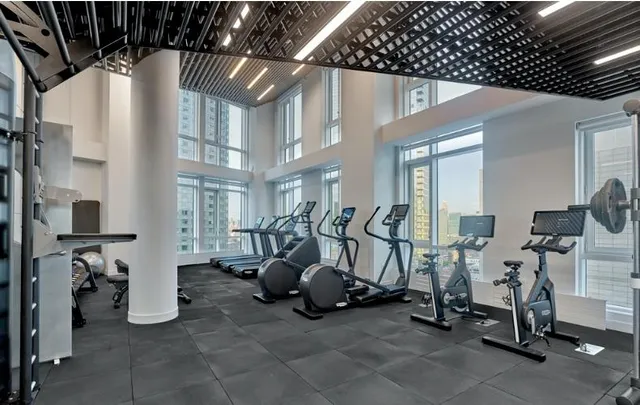 a living room with pool table and a window