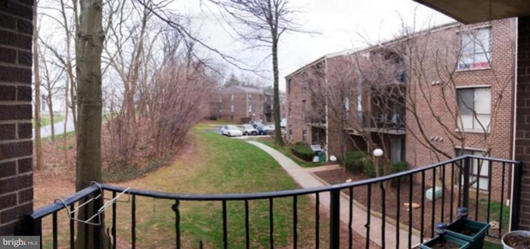 3230 Spartan Road, Unit 67 Olney, MD 20832 - Photo 11 of 11 a view of a pathway of a house and a yard