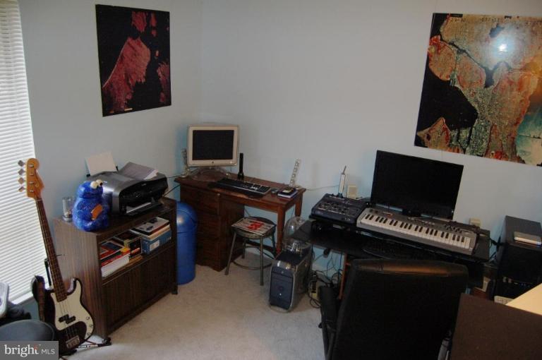 3230 Spartan Road, Unit 67 Olney, MD 20832 - Photo 8 of 11 a view of a workspace with furniture and a flat screen tv