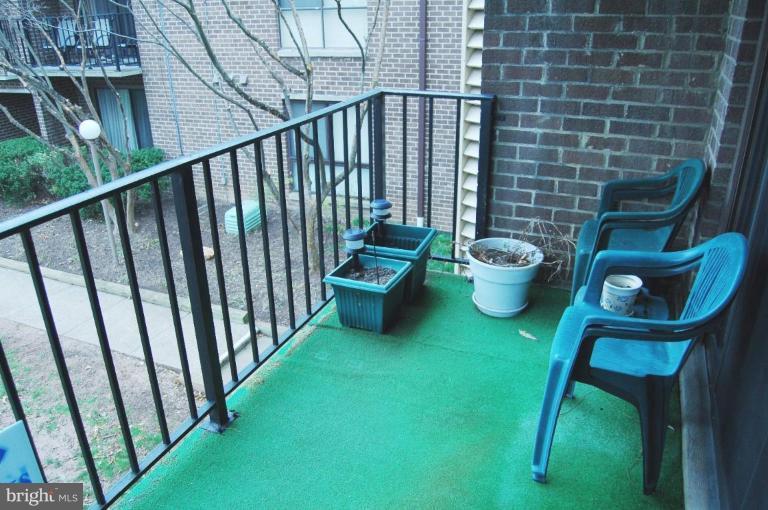 3230 Spartan Road, Unit 67 Olney, MD 20832 - Photo 10 of 11 a view of a chairs and table in backyard