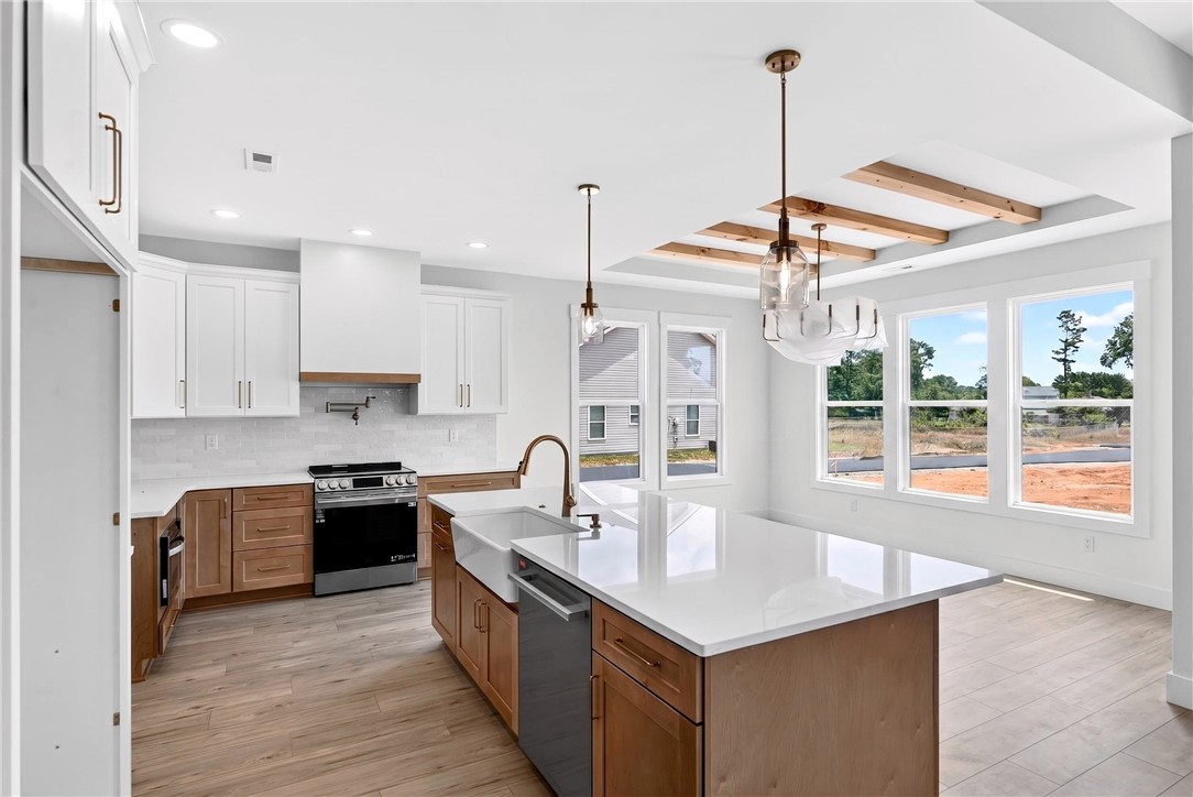 424 Blume Road Anderson, SC 29625 - Photo 9 of 30 A pristine culinary space with an island, modern appliances, and generous natural light.