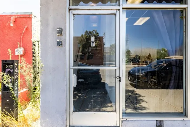 an aerial view of multiple houses with yard