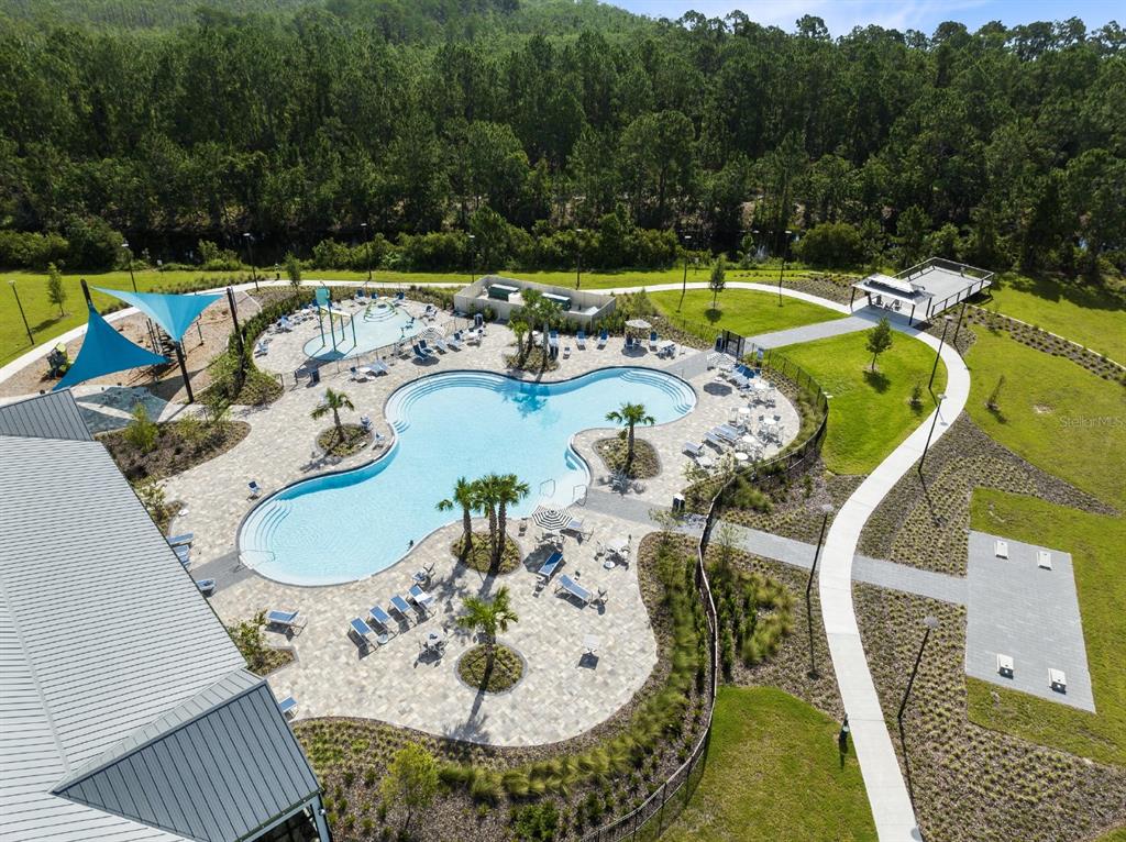 2520 Harmonia Hammock Road Harmony, FL 34773 - Photo 23 of 26 a view of a swimming pool with chairs