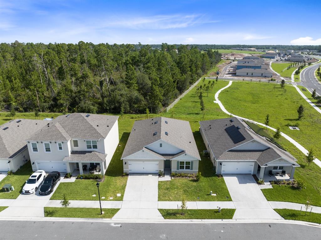 2520 Harmonia Hammock Road Harmony, FL 34773 - Photo 26 of 26 an aerial view of a house with a garden and pool