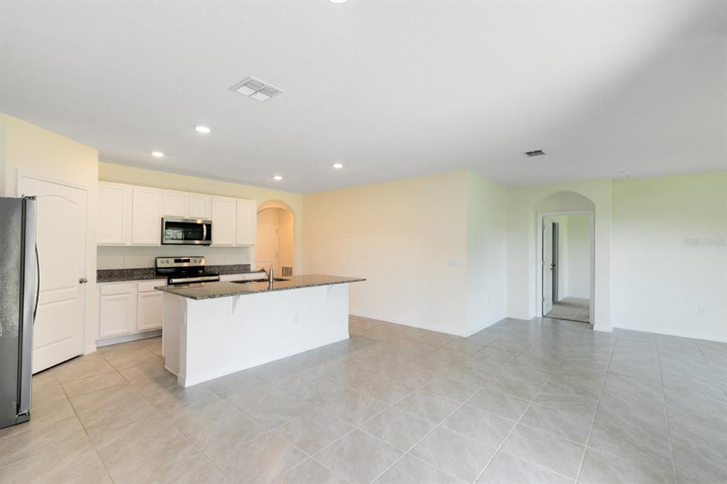 2520 Harmonia Hammock Road Harmony, FL 34773 - Photo 4 of 26 a view of kitchen with stainless steel appliances a refrigerator sink and stove