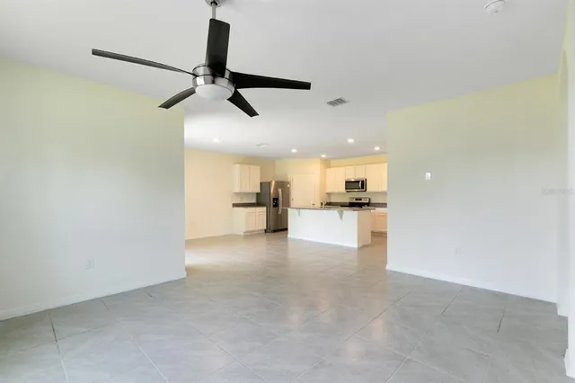 a view of an empty room with a window