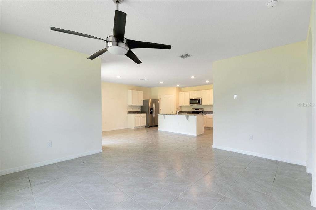 2520 Harmonia Hammock Road Harmony, FL 34773 - Photo 7 of 26 a view of empty room with kitchen view and window