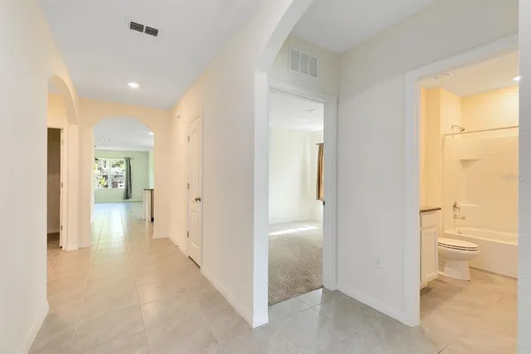 wooden floor in a hall with an entryway