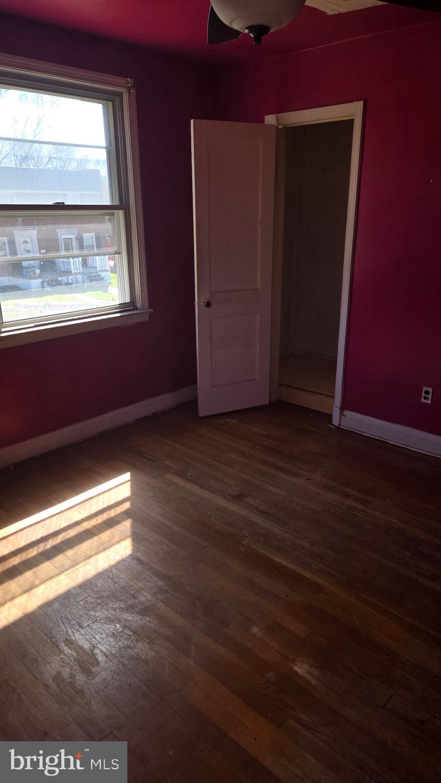 3706 Springwood Avenue Baltimore, MD 21206 - Photo 11 of 12 a view of empty room with wooden floor and fan