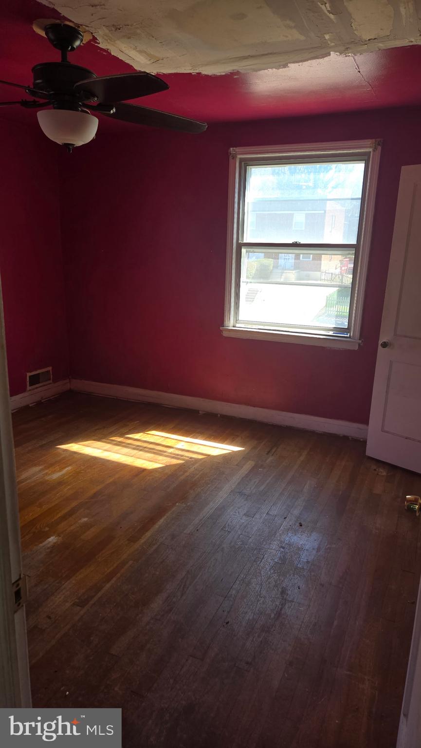3706 Springwood Avenue Baltimore, MD 21206 - Photo 5 of 12 a view of an empty room with a window