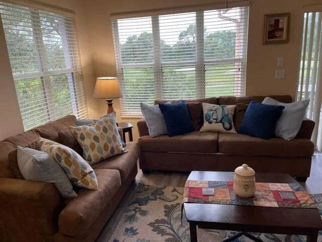 a living room with furniture and a window