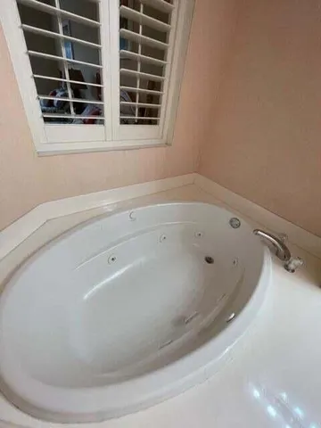 a view of a bathtub in a bathroom