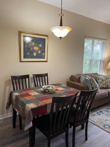 a view of a dining room with furniture