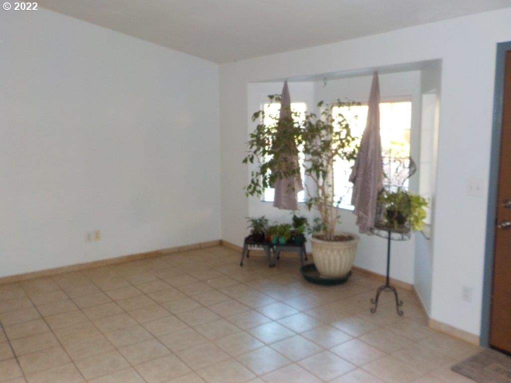 972 South 37th Place Springfield, OR 97478 - Photo 15 of 22 a view of a room with furniture and potted plants