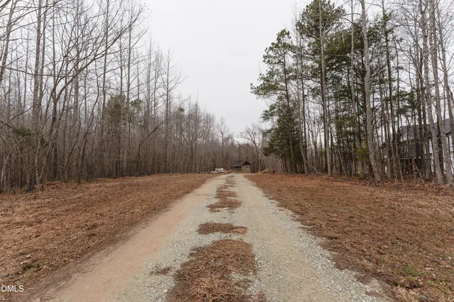 a view of a backyard of the house