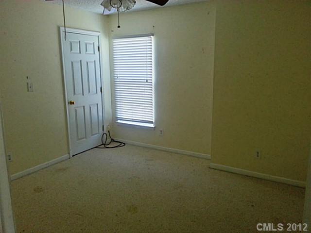 10546 Gold Pan Road Charlotte, NC 28215 - Photo 12 of 16 an empty room with windows