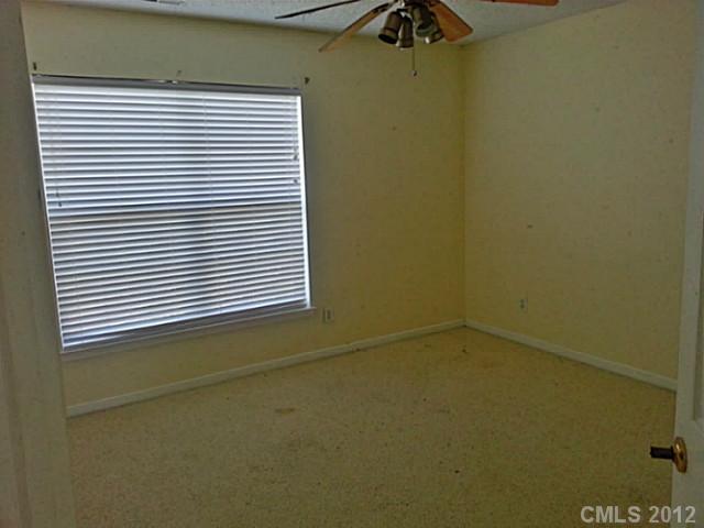 10546 Gold Pan Road Charlotte, NC 28215 - Photo 13 of 16 a view of a room that has a window in it