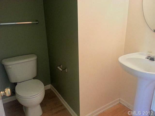 10546 Gold Pan Road Charlotte, NC 28215 - Photo 14 of 16 a bathroom with a toilet and a sink