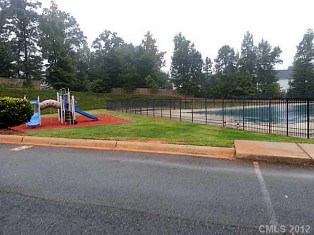 10546 Gold Pan Road Charlotte, NC 28215 - Photo 15 of 16 a view of outdoor space with playground and green space
