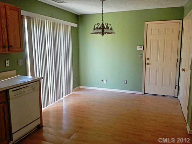 10546 Gold Pan Road Charlotte, NC 28215 - Photo 5 of 16 a view of a room with a windows and ceiling fan