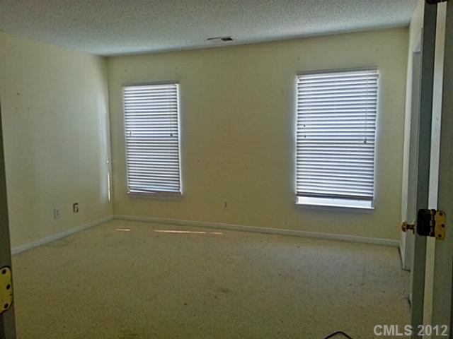 10546 Gold Pan Road Charlotte, NC 28215 - Photo 7 of 16 a view of a room that has a window in it