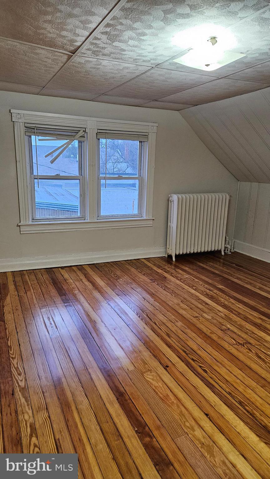 6330 Windsor Mill Road Gwynn Oak, MD 21207 - Photo 12 of 20 a view of a room with wooden floor