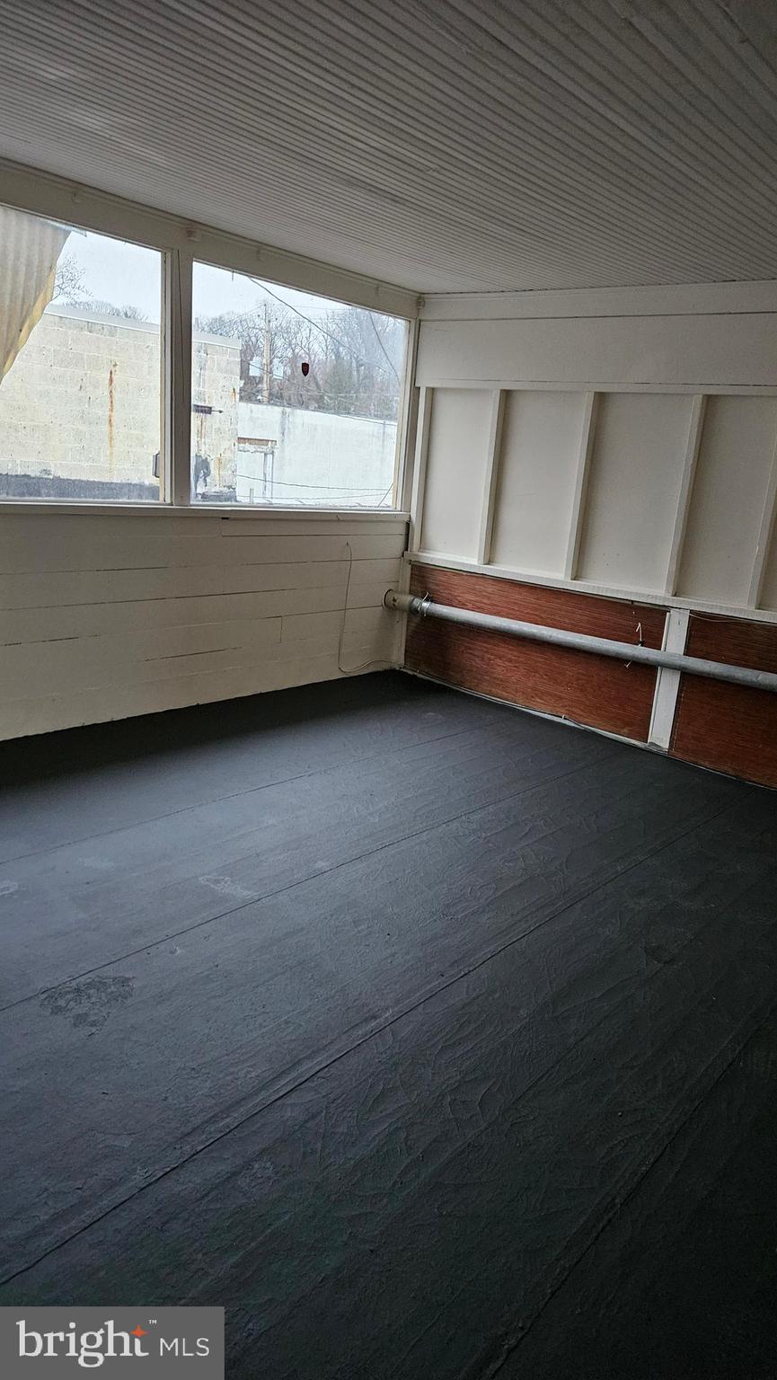 6330 Windsor Mill Road Gwynn Oak, MD 21207 - Photo 13 of 20 a bathroom with a bathtub and a window