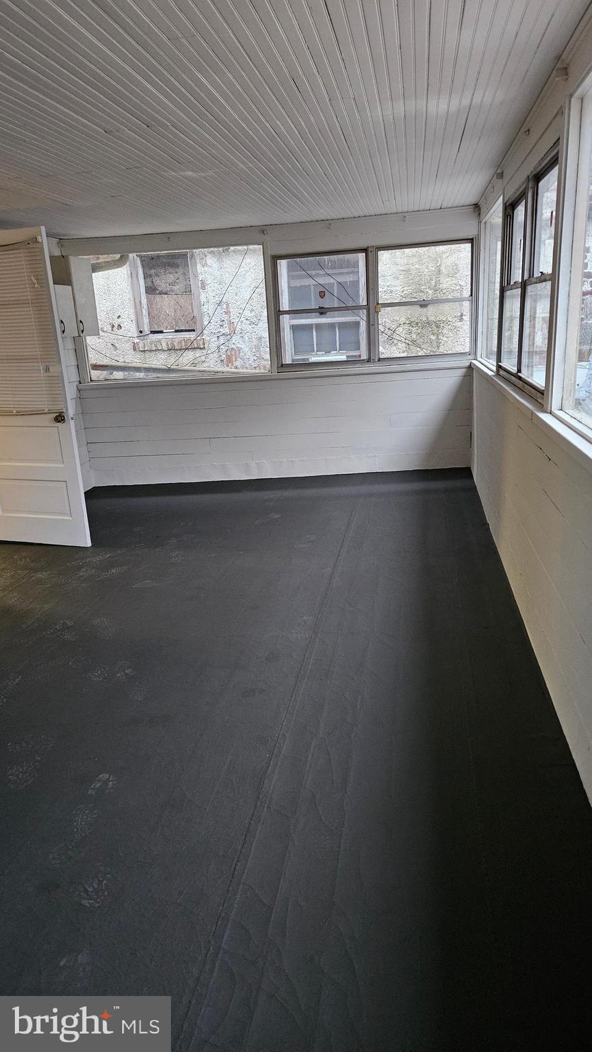 6330 Windsor Mill Road Gwynn Oak, MD 21207 - Photo 14 of 20 a view of an empty room with a window