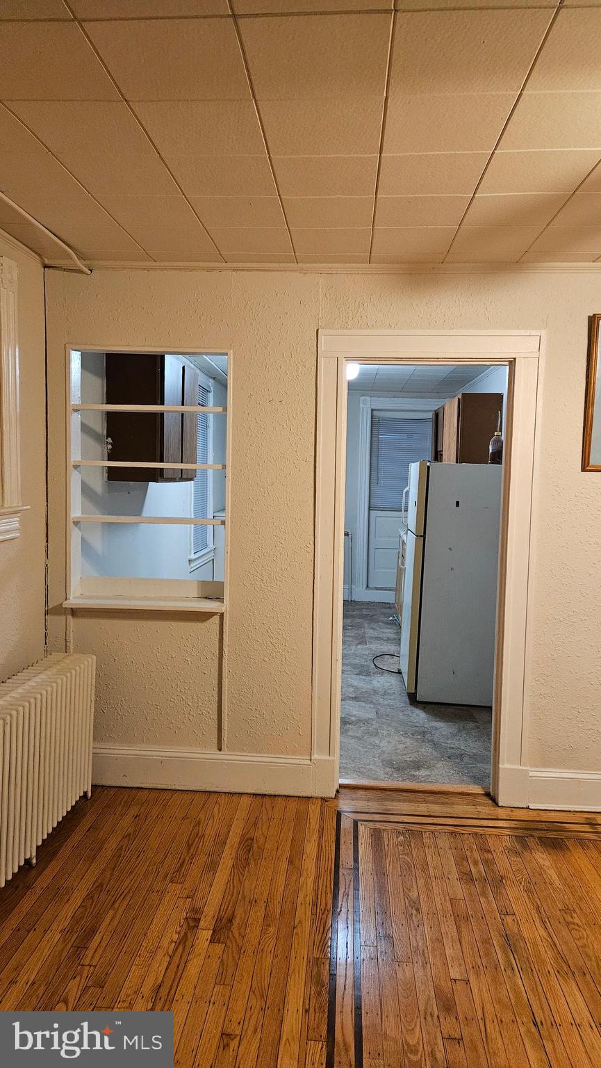 6330 Windsor Mill Road Gwynn Oak, MD 21207 - Photo 17 of 20 a view of a living room with wooden floor