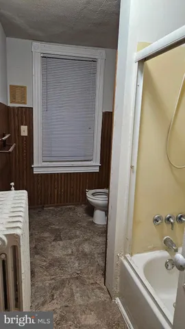 a bathroom with a sink a toilet and a bathtub