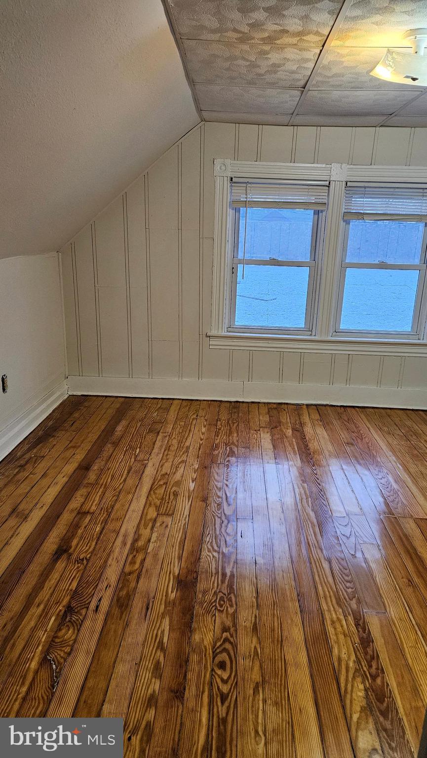 6330 Windsor Mill Road Gwynn Oak, MD 21207 - Photo 10 of 20 a view of a room with wooden floor