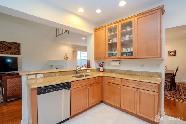a kitchen that has a sink and a stove in it