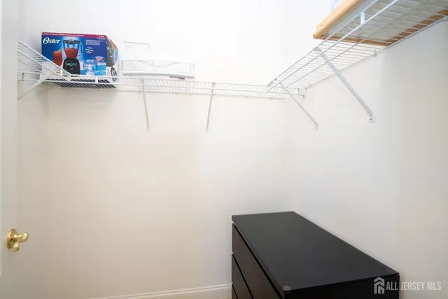 a small room with a shelf