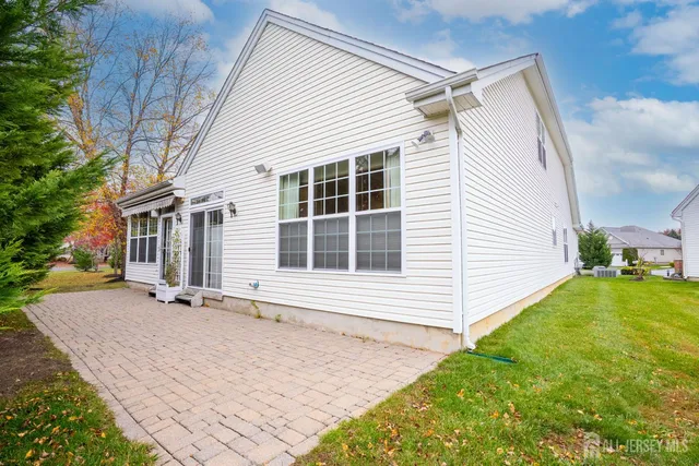 a view of house with backyard