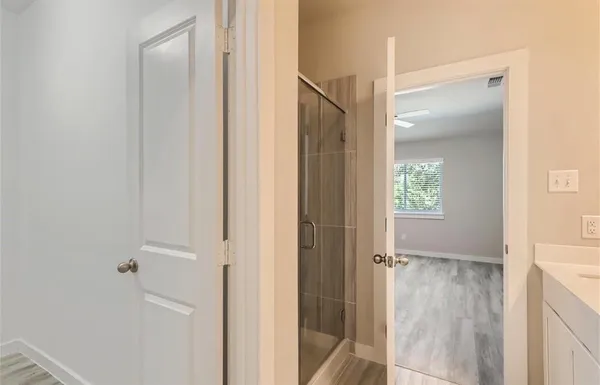 a view of a bathroom with a glass door