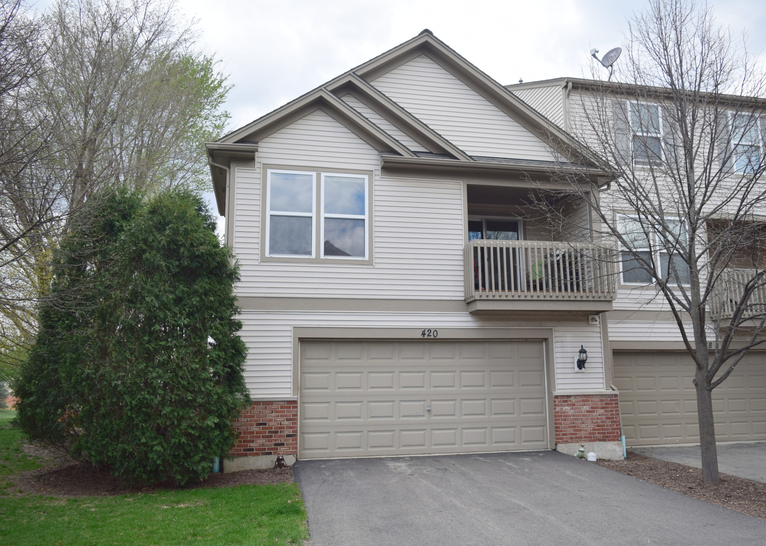 420 Valentine Way Oswego, IL 60543 - Photo 1 of 20 a front view of a house with a garden
