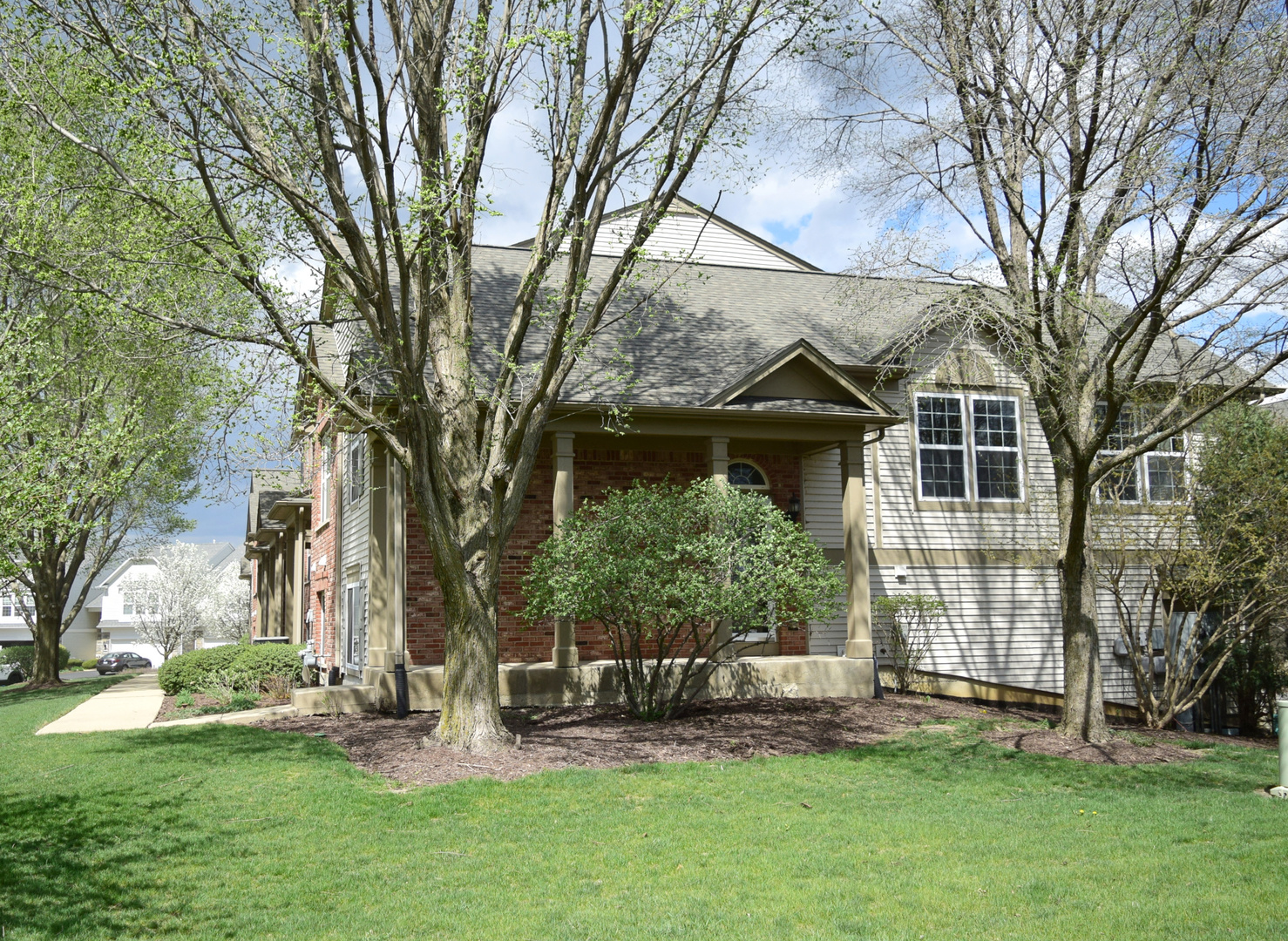420 Valentine Way Oswego, IL 60543 - Photo 20 of 20 a front view of a house with garden and trees