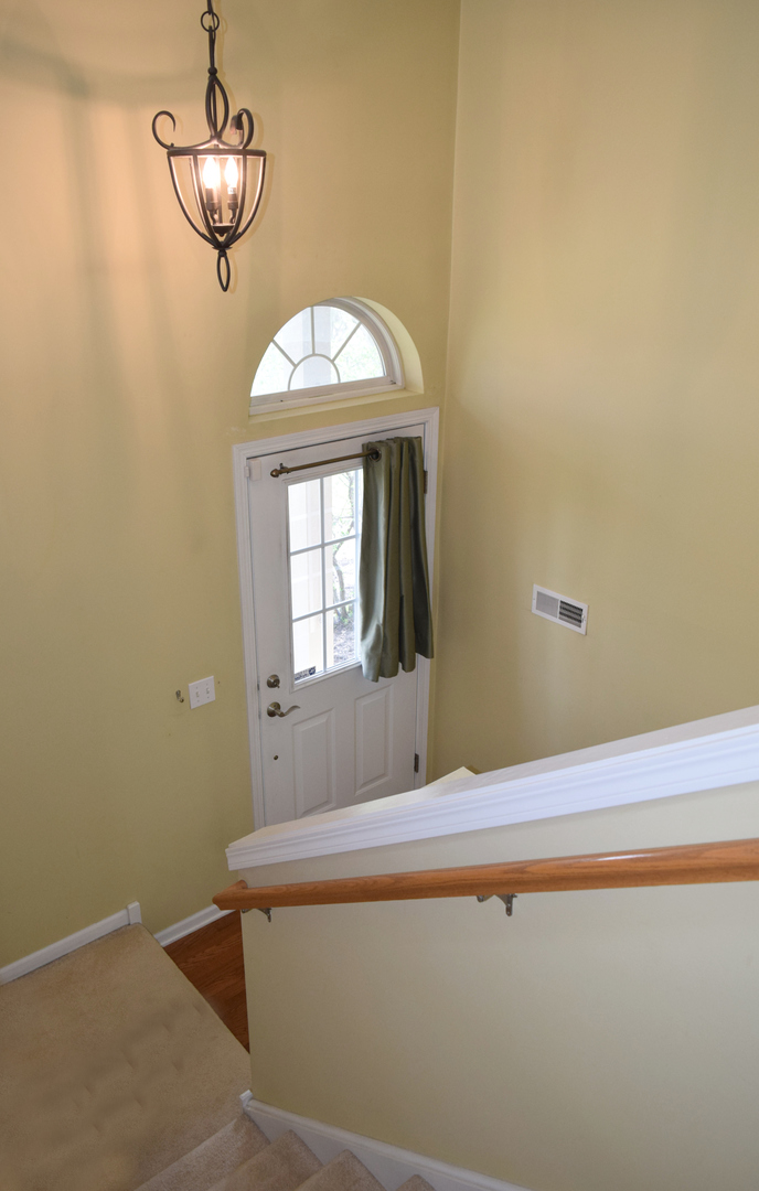 420 Valentine Way Oswego, IL 60543 - Photo 5 of 20 a bathroom with a bathtub and a window