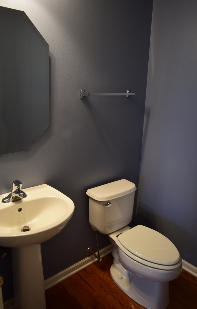 420 Valentine Way Oswego, IL 60543 - Photo 10 of 20 a white toilet sitting next to a bathroom sink