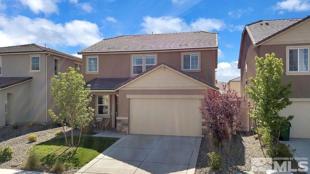 9727 Belville Drive Reno, NV 89521 - Photo 1 of 31 a front view of a house with garden