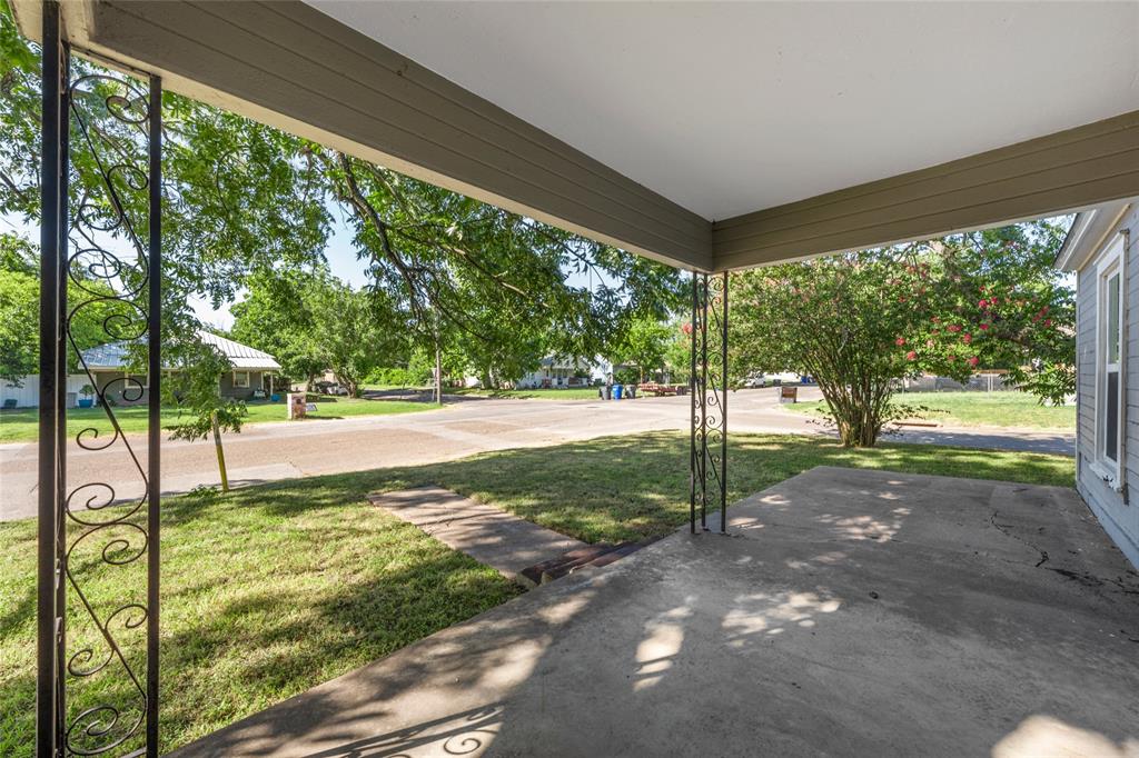 2225 Mitchell Avenue Waco, TX 76708 - Photo 13 of 16 Covered concrete patio with decorative wrought iron columns